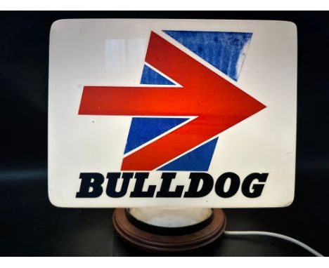 A Bulldog plastic petrol pump globe, faded.