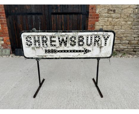 A Shrewesbury (right directional arrow) cast aluminium road sign on stand, reflectors have been painted over, some missing/da
