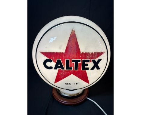 A Caltex pill-shaped glass petrol pump globe, date to neck, one small blemish to neck and minor nibbles to rim, see pics.