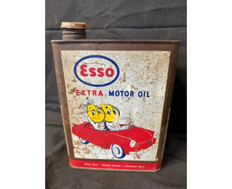 An Esso Extra Motor Oil can with image of Mr and Mrs. Drip in a car (French). 