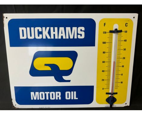 A Duckhams Motor Oil garage enamel advertising thermometer sign by Burnham, 26 1/2 x 20".