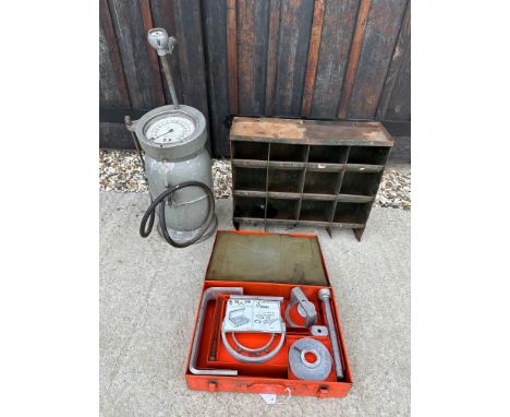 A forecourt tyre pressure inflator, a garage wall rack and a Renault took box.