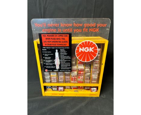 An NGK Spark Plugs garage dispensing wall hanging/counter top display cabinet. You'll never know how good your engine is unti