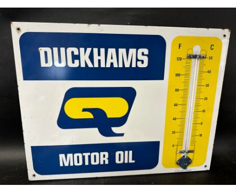 A Duckhams Motor Oil garage enamel advertising thermometer sign by Burnham, 26 1/2 x 20 1/4".
