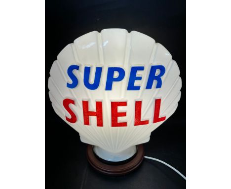A Super Shell (white) glass petrol pump globe by Hailware, stamped Property of Shell-Mex &amp; B.P Ltd to inside and numbered