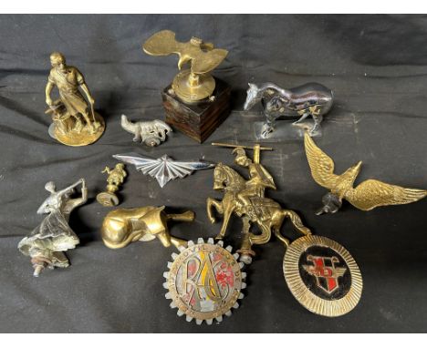 A Spanish RAC badge and a quantity of brass and other mascots etc. 