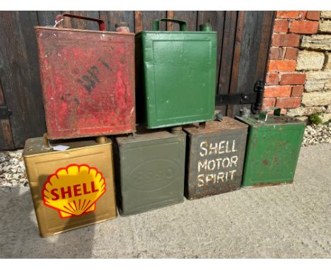 Six two gallon petrol cans inc. Esso, Shell, Shell-Mex &amp; BP, War Department etc. some with caps, varying conditions.