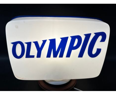 An Olympic raised letter plastic petrol pump globe. 