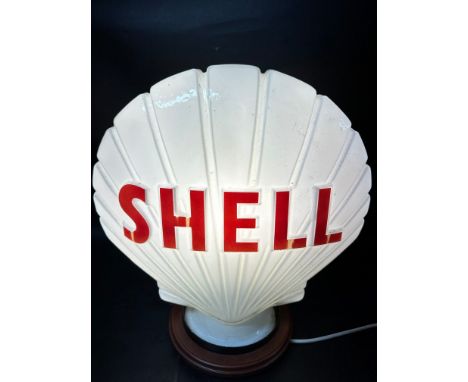 A Shell glass petrol pump globe by Hailware, faintly dated, stamped Property of Shell-Mex &amp; B.P Ltd. Returnable on Demand