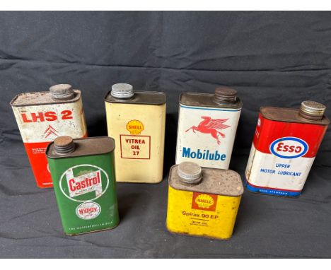 Six motor oil cans inc. Shell Vitrea Oil 27, Mobilube, Esso, Shell Spirac and Castrol.