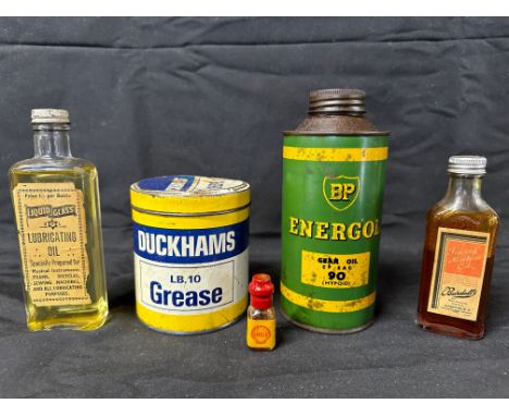A collection of lubricating oil bottles/tins inc. Duckham's, BP, Shell etc.