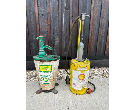 A BP forecourt oil dispenser and a Shell oil dispenser trolley. 