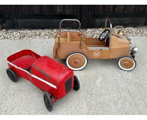A child's pedal car and a fire engine pedal vehicle.