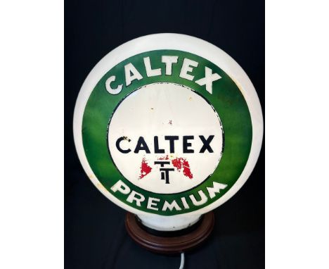 A Caltex TT Premium pill-shaped glass petrol pump globe, one small blemish and minor nibbles to rim.