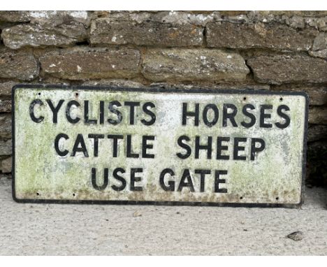A cast aluminium road sign - Cyclists Horses Cattle Sheep Use Gate, 39 x 15 1/2".