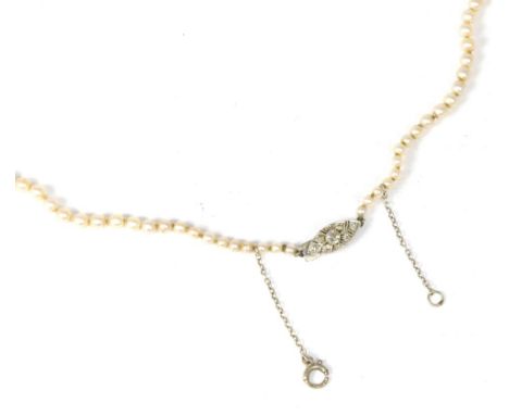 A cultured pearl necklace, graduated cultured pearls knotted to a diamond set lozenge clasp, length 42cm 