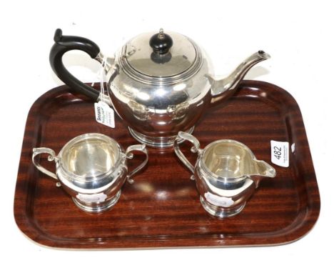 An Art Deco silver three piece tea service, Mappin & Webb, Birmingham 1936/37, the teapot 23.5cm long, 21.2ozt  