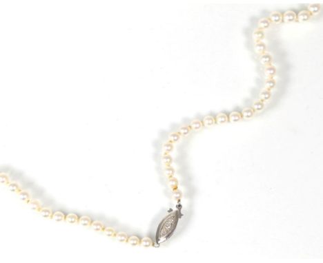 A cultured pearl necklace, with a diamond set clasp, graduated cultured pearls noted to a lozenge-shaped clasp set with three