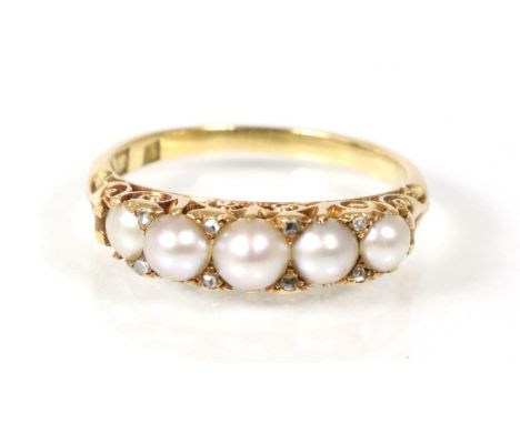 A split pearl ring, ring stamped 18 