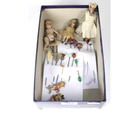 Collection of hat pins including a silver example stamped '925', and other decorative examples; five bisque dolls house dolls