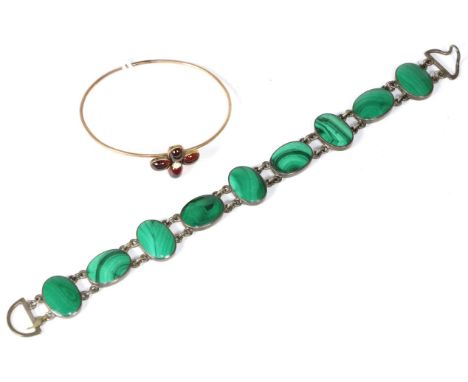 A Scottish malachite bracelet, of oval malachite links, length 20cm and a garnet bangle, of four oval cabochon garnets with a