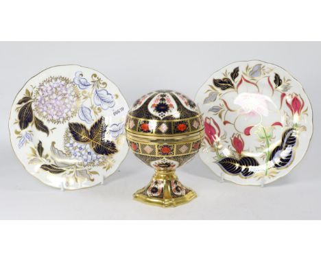 A Royal Crown Derby Imari globe form table clock, boxed and two Royal Crown Derby cabinet plates 