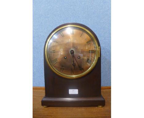 A 19th Century mahogany bracket clock, the brass dial bearing Russells Ltd., 10 Exchange Street, Manchester inscription 