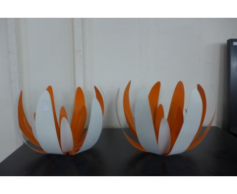 A pair of Scandinavian orange and white metal light shades 