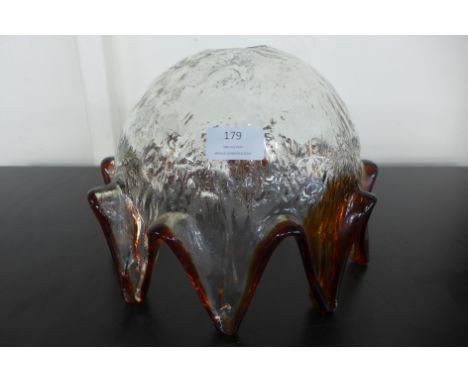A hand blown coloured glass light shade 