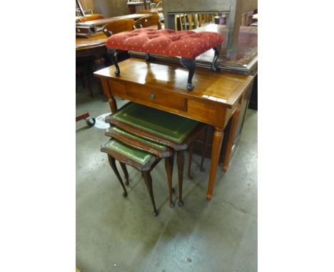 A mahogany and green leather topped nest of tables, a mahogany side table and a stool 