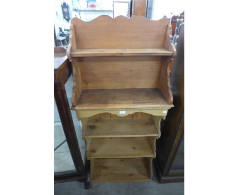 A pine wall mounted bookcase and a pine shelf 