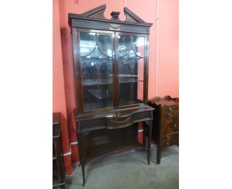 An Edward VII Chippendale Revival mahogany cabinet on stand 