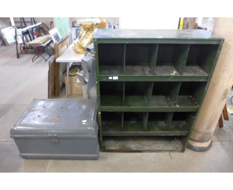 An industrial metal cabinet and a steamer trunk 