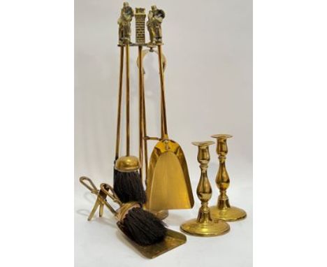A group of brassware comprising a fire companion set modelled with Victorian chimney sweep figure handles (h- 47cm), a pair o