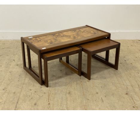 A mid century teak tile top coffee table, with a pair of nesting tables under H40cm, W96cm, D48cm