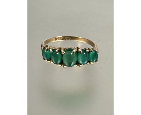 A 9ct gold five stone graduated emerald ring, each oval cabochon set in four claw setting, S. 2.3g	