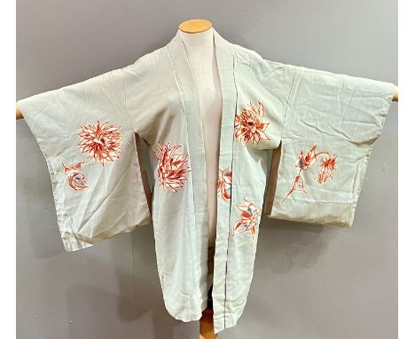 A Japanese silk-lined kimono with abstract chrysanthemum motifs in orange against a light blue ground