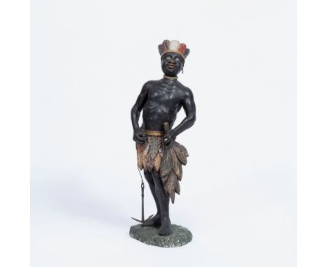 Figur eines Afrikaners. Um 1800. Holz, geschnitzt, farbig gefasst, Metall. H. 77 cm. Zustand Erg., kl. Rest. Auf Terrainplint
