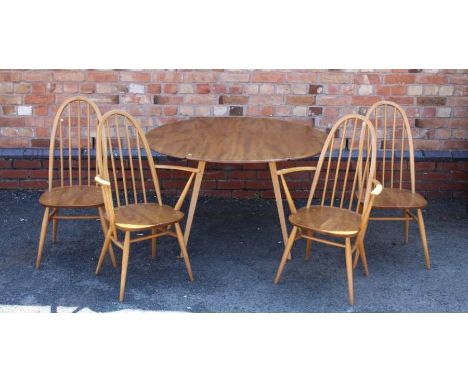 An Ercol dining table, oval drop leaf form, 113cm, together with a pair of single and a pair of carver stick back chairs