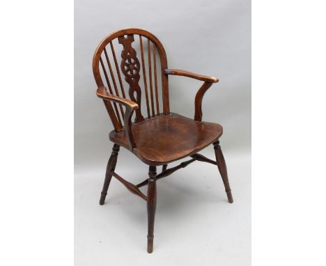 A 19th century hoop and stick back arm chair, possibly elm seat on turned legs