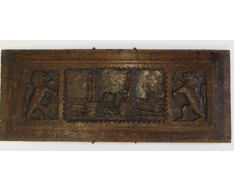 An early 18th century carved oak panel, featuring men of war, sail battleships, flanked by lions, 19.5cm x 49cm