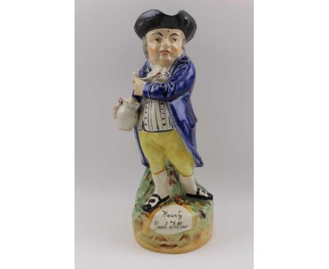 A Victorian Staffordshire "Hearty good fellow" toby jug typically standing with pipe and foaming ale jug 28cm tall  