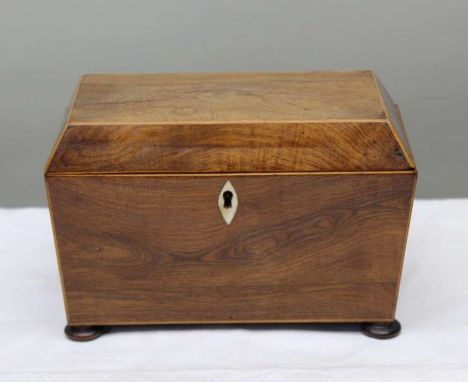 A 19th century mahogany and satin wood banded sarcophagus tea caddy, with twin lidded interior 