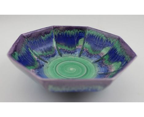 An Art Deco Shelley ceramic bowl of octagonal form, glazed in a blue, green, and purple drip pattern, factory stamp to base, 