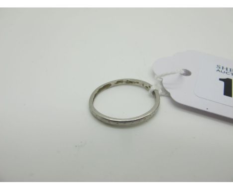 A Plain Band, stamped "Platinum" (finger size K) (1.8grams). 