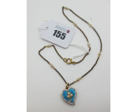 A Pearl Set Heart Shape Locket Pendant, highlighted in turquoise and white enamel, the glazed panel verso encasing lock of ha