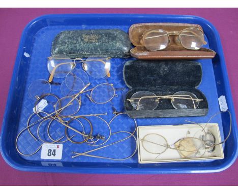 A Collection of Assorted Antique and Vintage Spectacles and Pince-Nez, one case tooled in gilt "Thos James Prop A. F. Colyer,