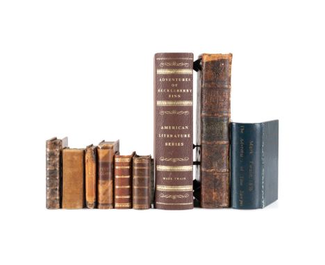 Group of book safes and boxes comprising three bokk safes, one leather with gilt titles and author, being titled "Adv. of Huc