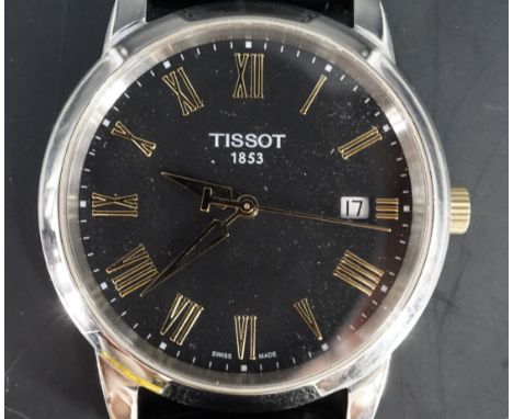 A Tissot 1853 quartz wristwatch, model T033410A, having a black face with date aperture, gilt Roman numerals and conforming d