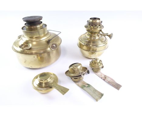 A Valour brass bodied paraffin greenhouse heater, a central draught Jones and Willis Cathedral oil lamp, two oil lamp burners